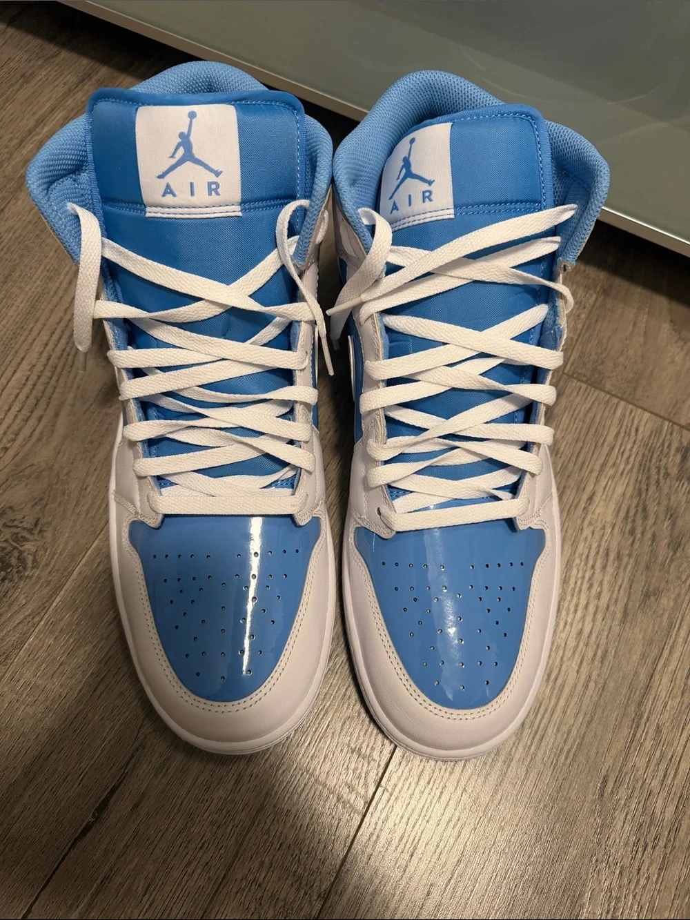 Air Jordan 1 Mid-Top Sneakers in White and Light Blue